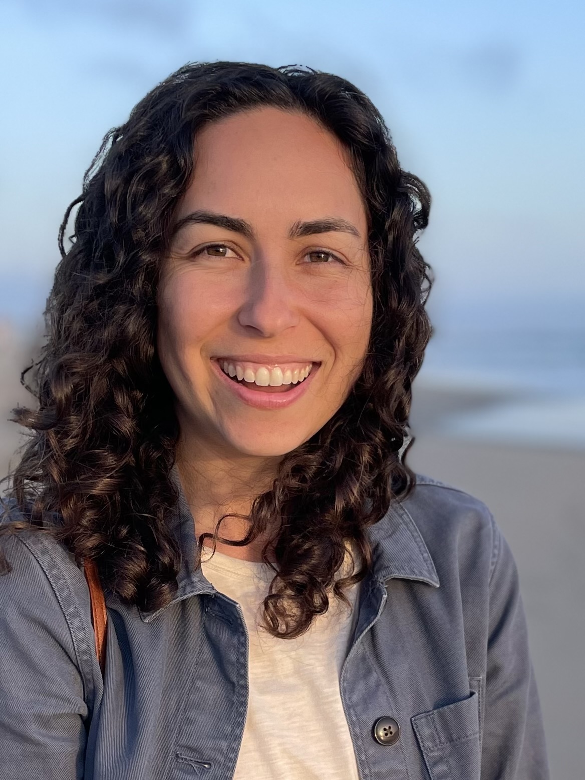 me smiling with my mouth open at the beach